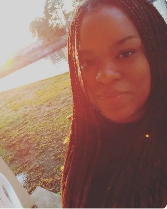 Amy Kelly outdoors in the golden light of sunrise
